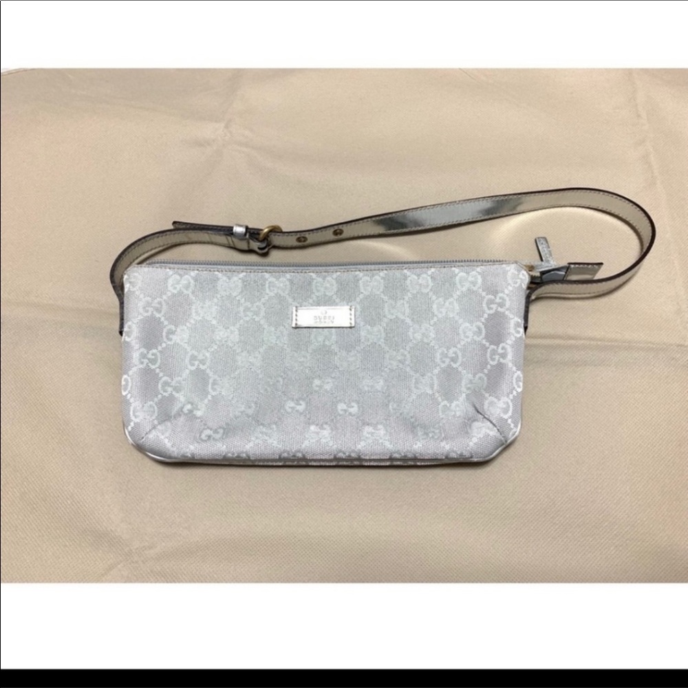 Authentic Gucci Silver Signature “GG” Canvas Poche